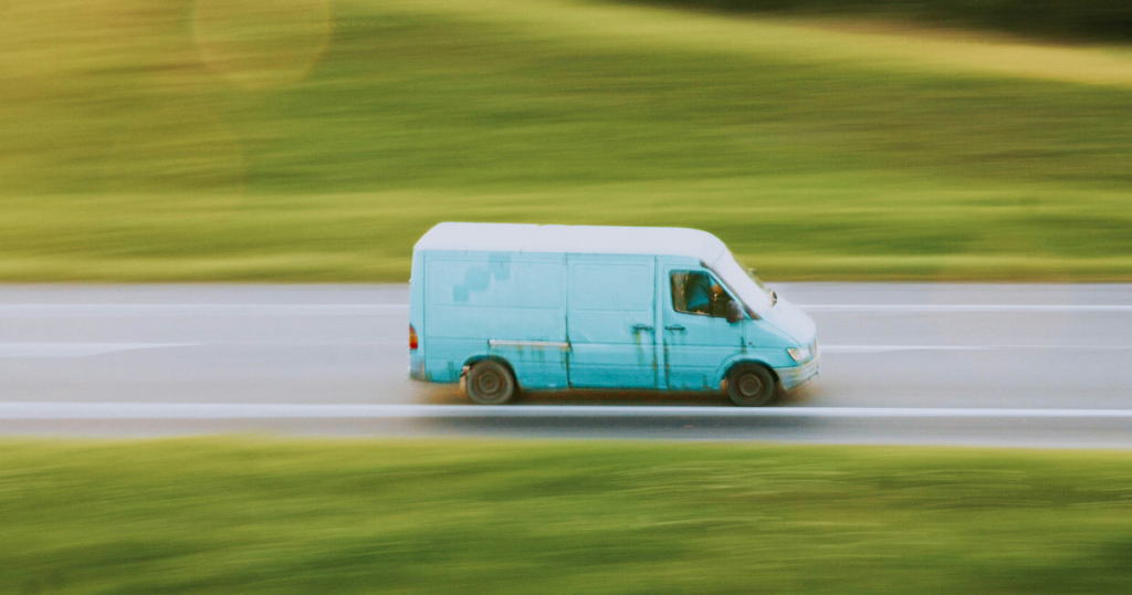 Van driving on road